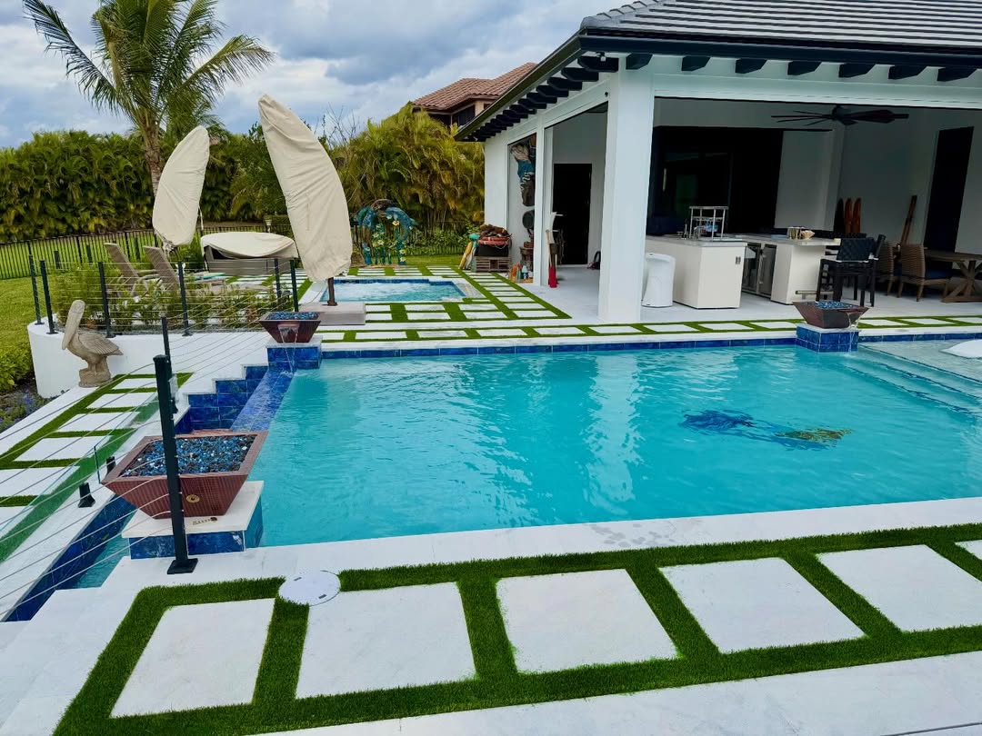 Custom pool with tropical landscaping